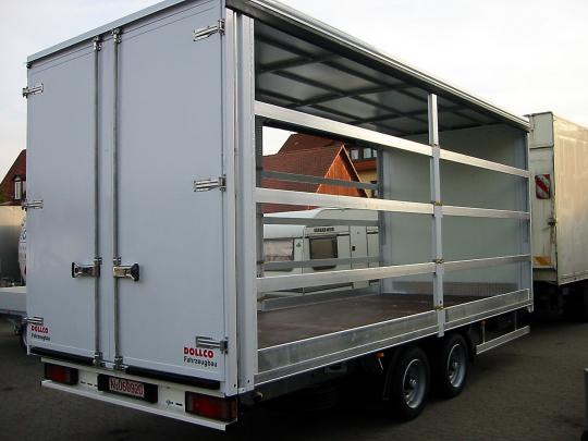 Large tandem-axle box trailer with rear double doors and an open side frame (for curtain-side/tarpaulin setup) — ideal for volume transport, furniture and palletized goods.